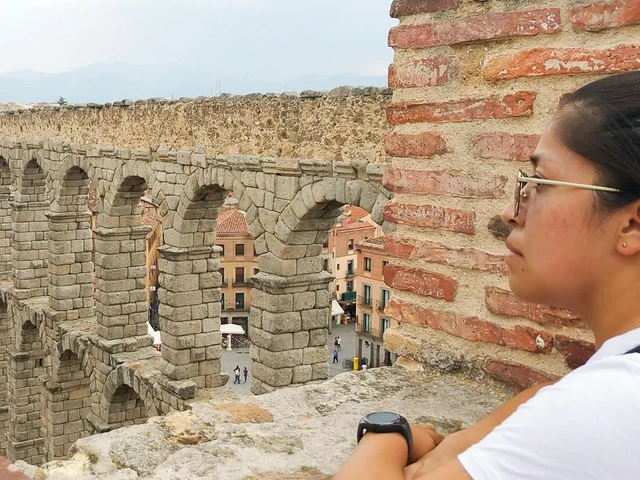 Girl staring at old building