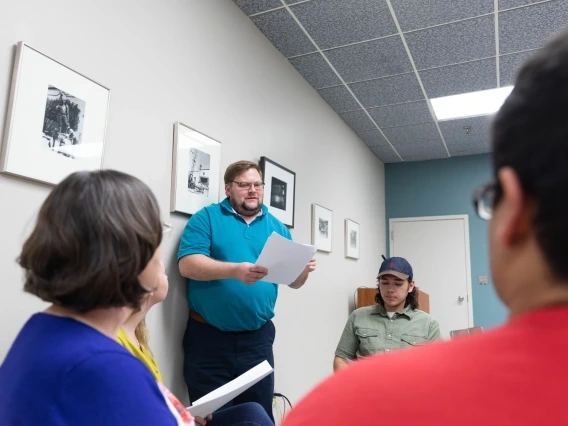 Professor holding paper